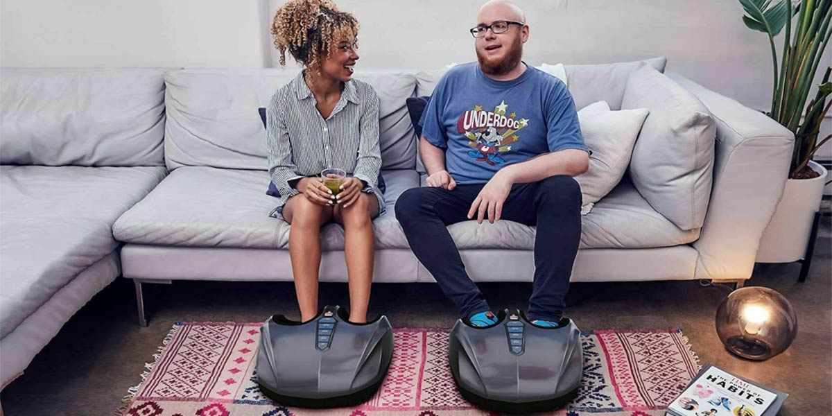 Woman and man using foot massager